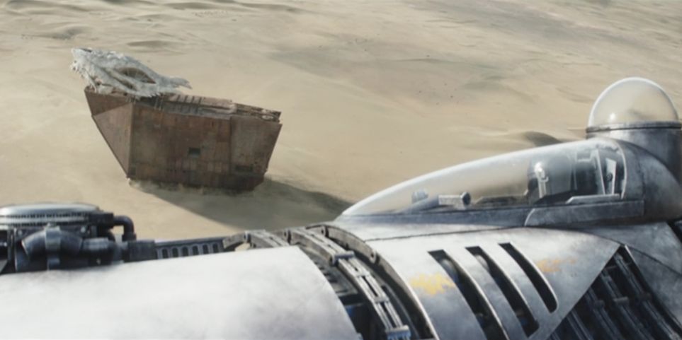 Din-Djarin-sees-Jawas-attach-Krayt-Dragon-skull-to-sandcrawler-in-Star-Wars-The-Book-of-Boba-Fett-90bc3e8d